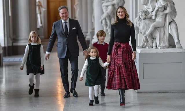 Princess Leonore and Princess Adrienne wore an emerald velvet pinafore dress by Trotters Kids. Chris O'Neill and Prince Nicolas