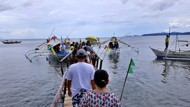 boats at the Sabang Boat Terminal, awaiting for their turn to load passengers and depart to the underground river