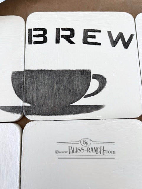 Recycled coasters stenciled with Old Sign Stencils