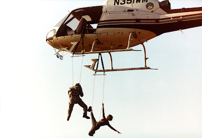 Photographer Joe McNally and actress Michelle Yeoh suspended from a helcopter over the Hollywood sign in Californaia, 1998