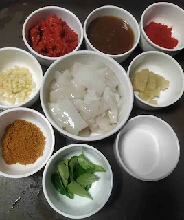 Squid fry ingredients tawa fry masala, red chilli powder, curry leaves, garlic, squid rings