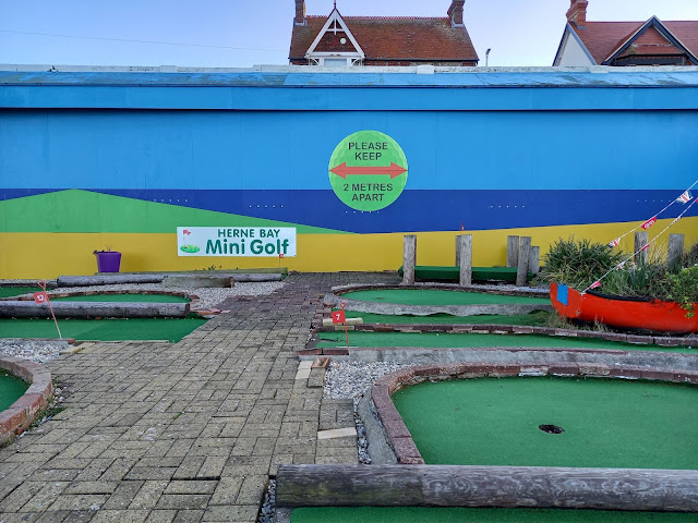 A social distancing sign on the Herne Bay Mini Golf course