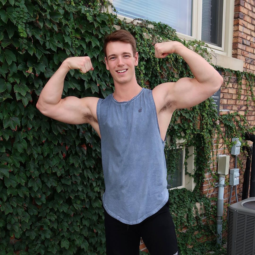 strong-sexy-guy-flexing-big-biceps-ben-petersen-cute-smile-boyfriend-goals
