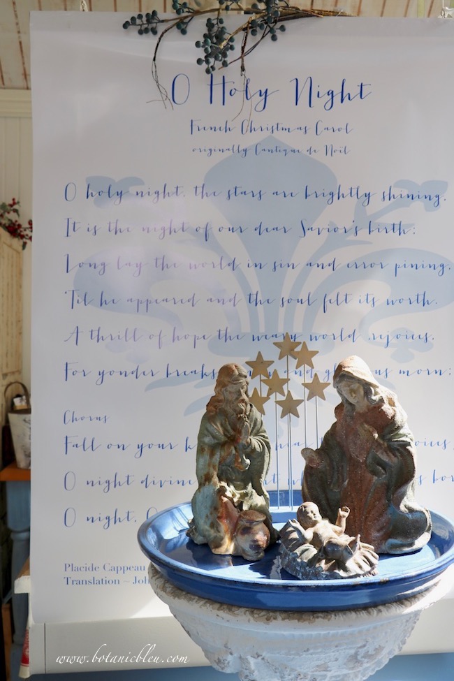 A French Christmas carol, O Holy Night, is the background for a large Holy Family as Christmas decor