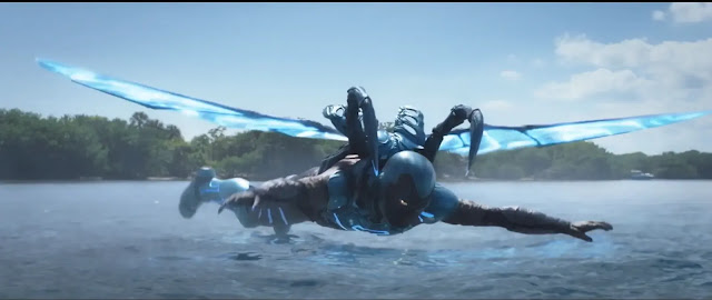 Blue beetle flying with his wings