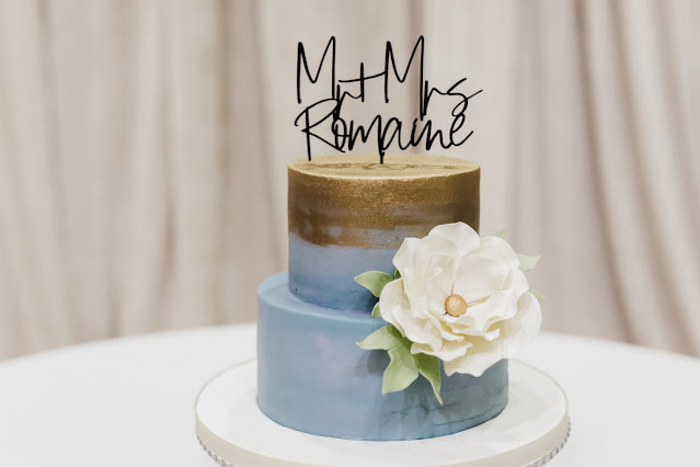 blue and gold two tier wedding cake