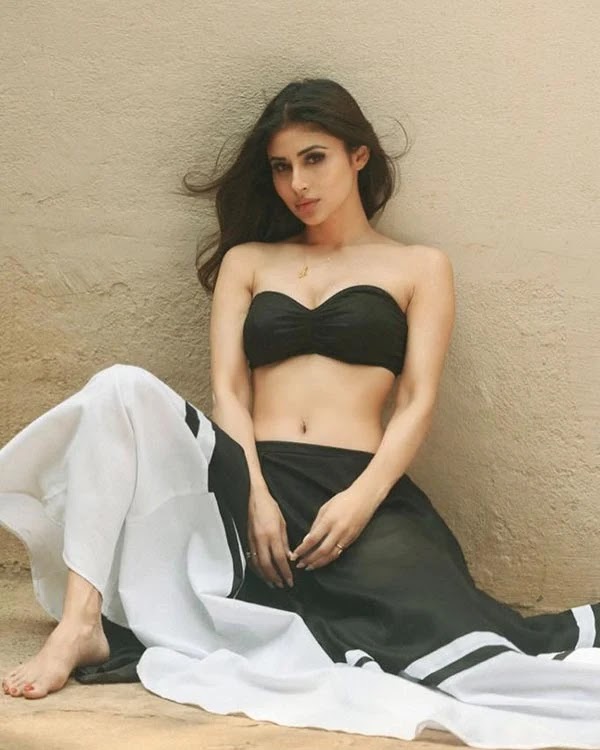 Mouni Roy in this off shoulder bikini top paired a long skirt looks sizzling hot.