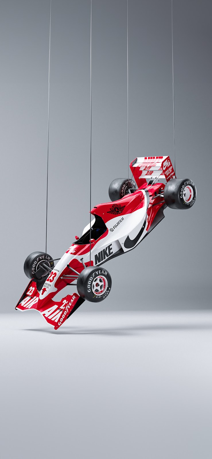 A retro-inspired Formula 1 racing car with Nike branding, suspended in mid-air.

