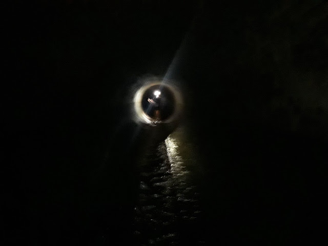 Darkness of the tunnel on underground tunnel tour