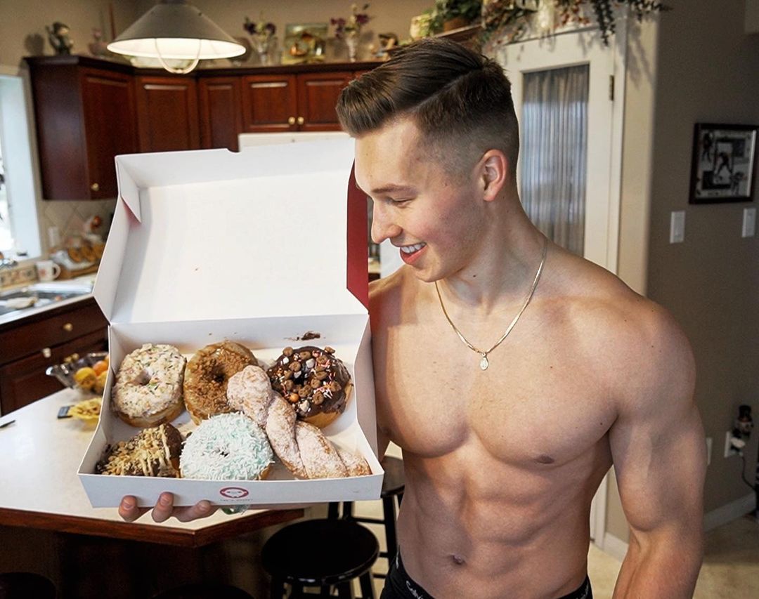 shirtless-young-muscle-dude-bret-mossing-smile-doughnuts