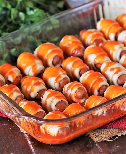 Pigs In a Blanket Glazed with Buffalo Sauce Image