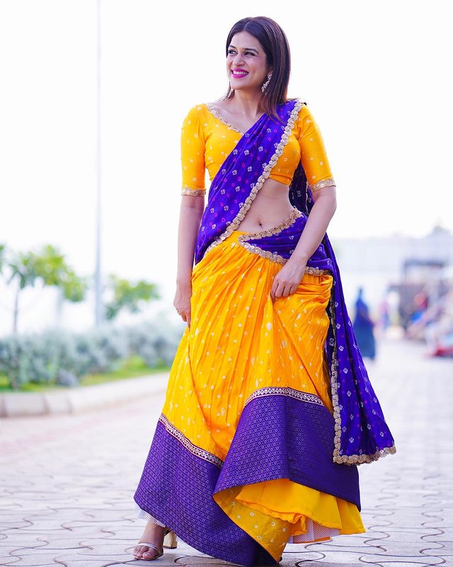 Shraddha Das Dazzles in the Radiant Blend of Purple and Yellow Half Saree
