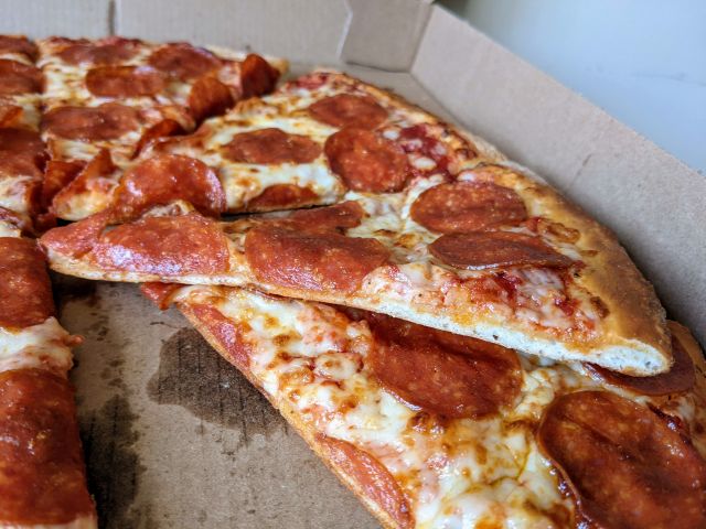 Cross-section of a slice of Papa John's NY Style Pizza.