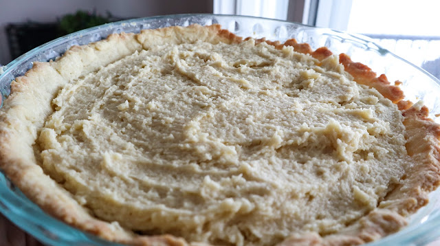 layer of the almond meal flour (cake batter) on top of the partially baked tart
