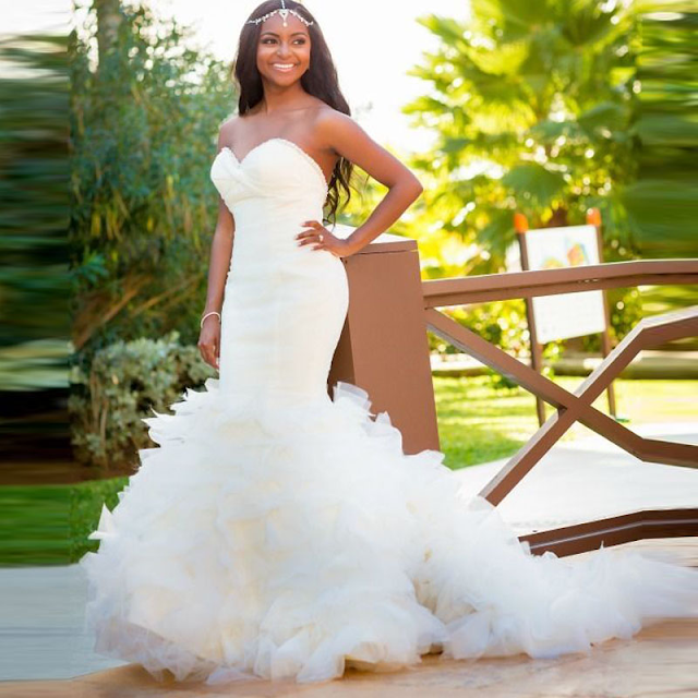 A in a beautiful white mermaid wedding gown.