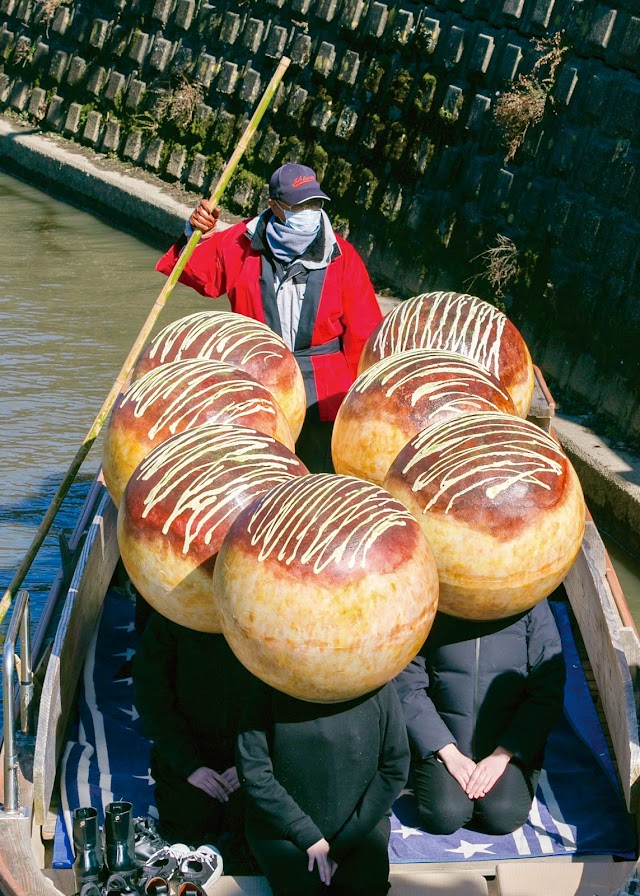 A Giant Takoyaki Boat Sails Down A River In Japan