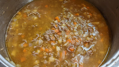 To make the stock, mix the stock pots with the water. Add to the pan