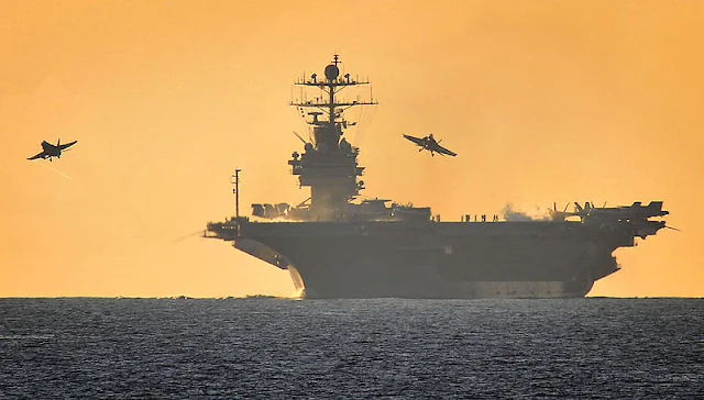 Cover Image Attribute: The file photo of American Nimitz class aircraft carrier USS Harry S Truman is pictured during flying operations in the company of HMS Somerset in the Mediterranean. / Source: LA(Phot) Jennifer Lodge, Royal Navy, 04142001, MOD, 3 June 2010.