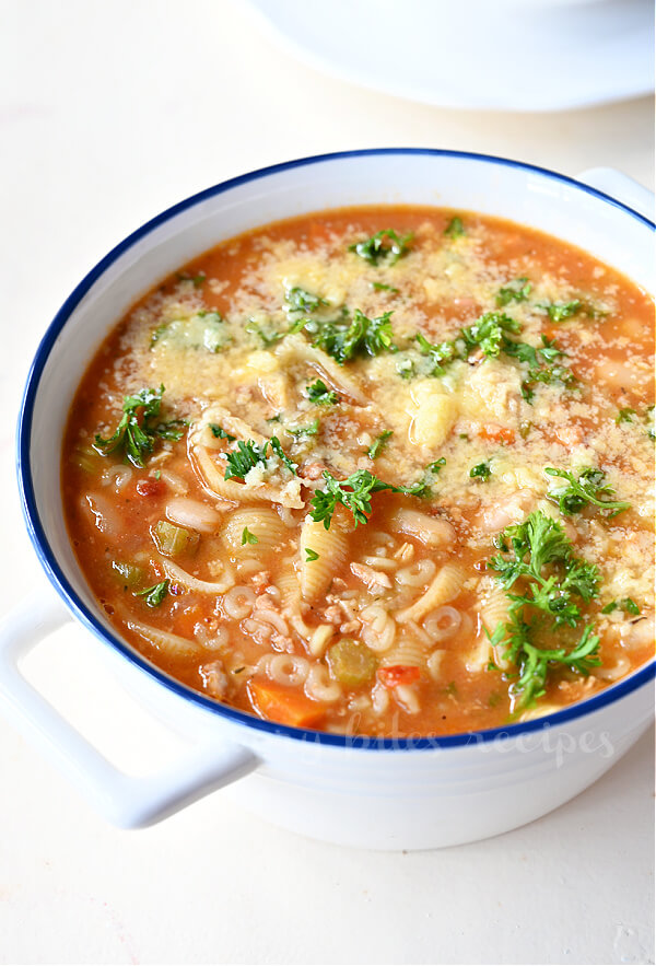 a closer look at pot with eat psta fagioli soup with parmesan and parsley