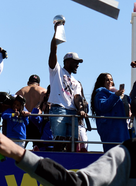 Outside linebacker Leonard Floyd hoists up the Vince Lombardi Trophy during the Los Angeles Rams' Super Bowl LVI championship parade...on February 16, 2022.