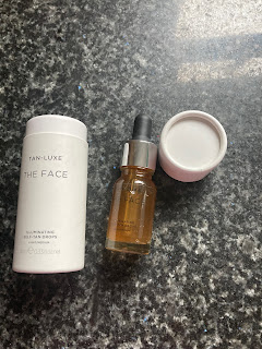 Packaging and bottle of Tan Luxe The Face Illuminating Self-Tan Drops – Light/Medium