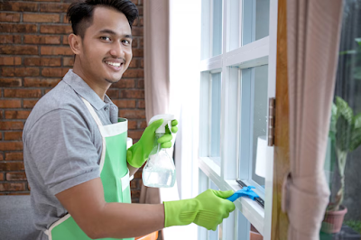 Smiley Man cleaning window