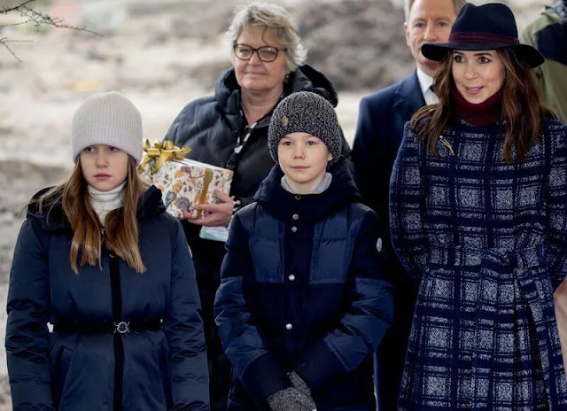 Crown Princess Mary wore a meghan check wrap coat by Hobbs, and wine red turtleneck sweater. Princess Josephine and Prince Vincent