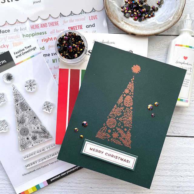 Christmas Card made with: Scrapbook.com Festive Tree and Greetings stamp, Jewel Sticker Book, Christmas smooth cardstock; Pinkfresh jewels; Ranger super fine copper embossing powder