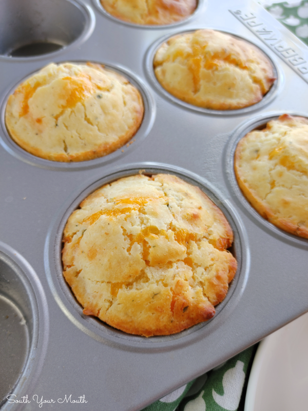 Cheddar Garlic Muffins! A quick and easy recipe for tender, savory muffins packed with cheddar cheese and garlic. An easy way to put fresh, hot, homemade bread on the table without much fuss!