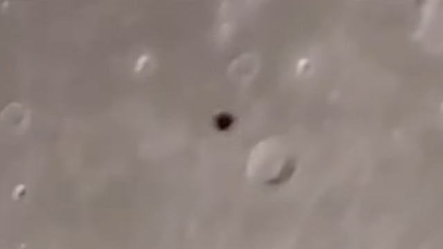 UFO passing by the Moon really surprises the amateur astronomer recording it through his own telescope at night time.