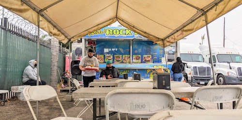 Tables under the tent for customers