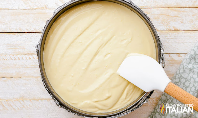 smoothing cheesecake batter in pan