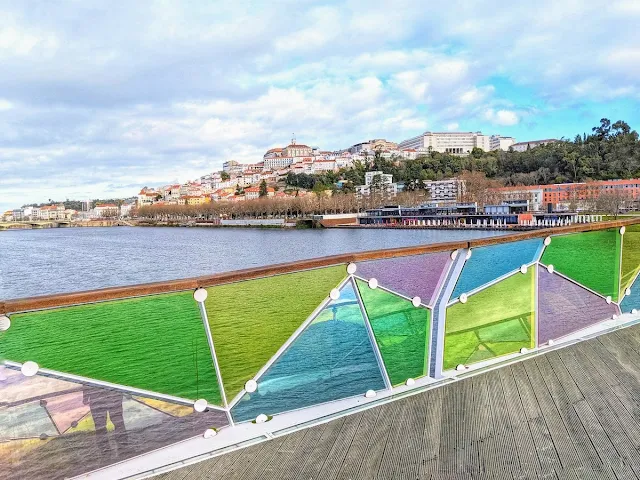 Coimbra viewed from a colorful bridge