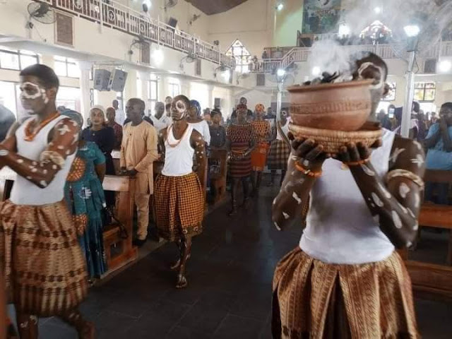 Photos from a Catholic church in Abuja celebrating mass using African cultural items surface online