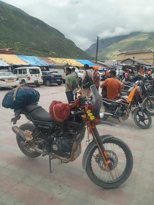 Bikers on the pilgrimage route at Badrinath Temple Town  car park.