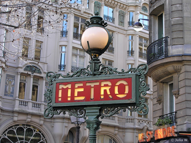 Lamppost with iconic metro sign in Paris