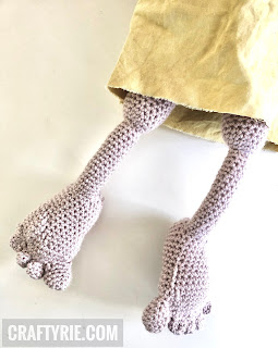 Two crocheted feet & legs from the Dobby toy.