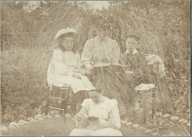 Family seated in garden