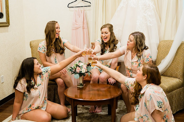 bridesmaids cheers with champagne