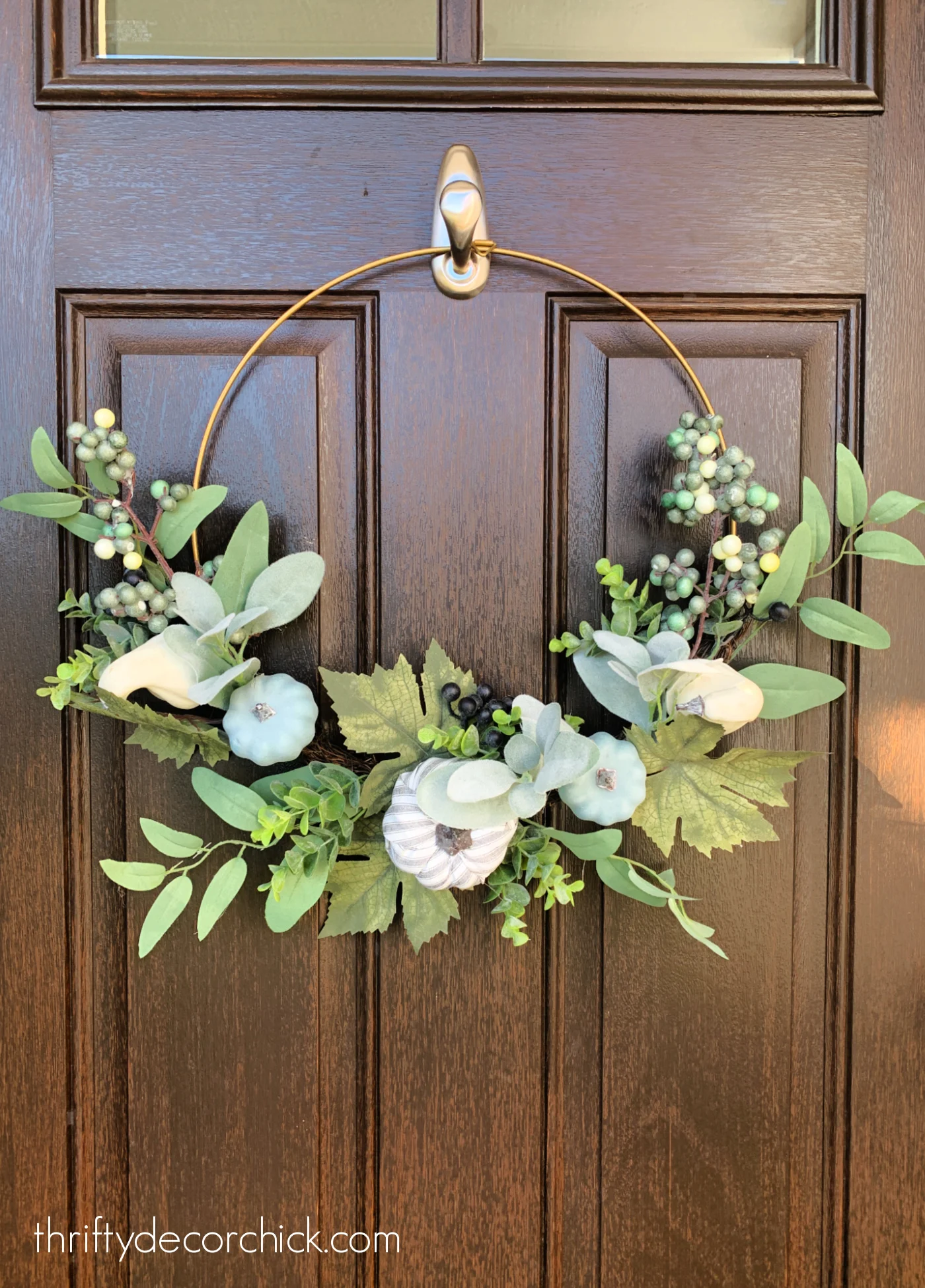 green and blue fall wreath on metal ring