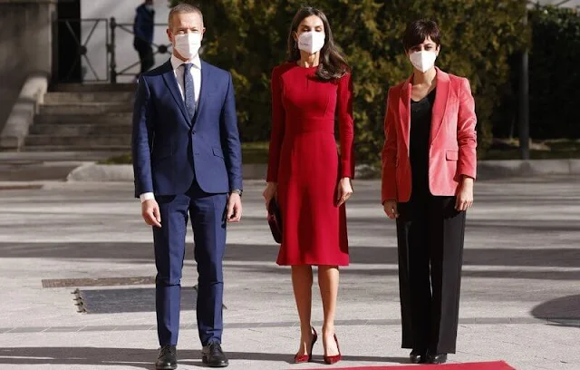 Queen Letizia wore a red dress by Carolina Herrera. Ruby earrings from Joyería Aldao 1911. New red pumps and bag by Magrit