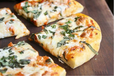 TRADITIONAL FLATBREAD IS OFTEN CONSIDERED TO BE WHAT MODERN-DAY PIZZA WAS ORIGINALLY BASED OFF OF. WHAT COUNTRY DID FLATBREAD ORIGINATE FROM