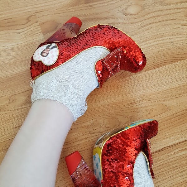 legs with ruby red sequins sparkling shoes