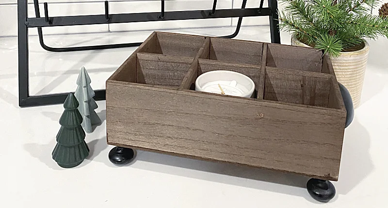 wooden box with Christmas trees and a candle