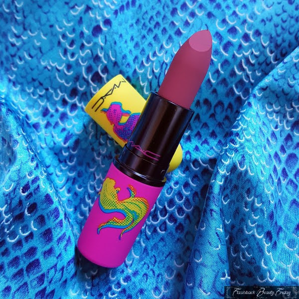 MAC Brickthrough Powder Kiss Lipstick on fish fabric background