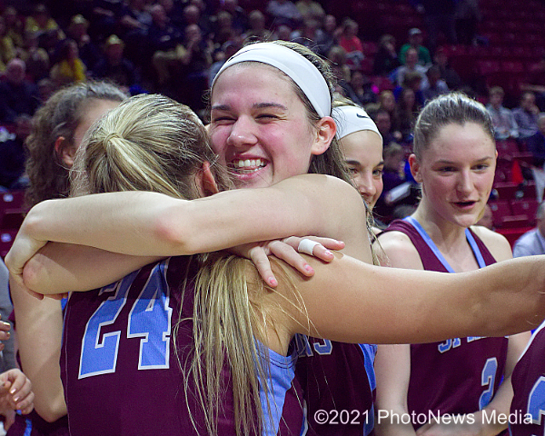 St. Joseph-Ogden's Peyton Crowe hugs teammate Bree Trimble 