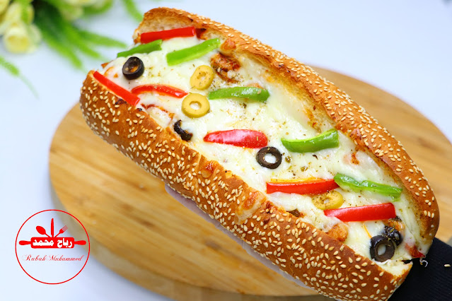 تشيكن بيتزا ساندويش بطعم ينافس اكبر المطاعم العالمية من وصفات البيتزا المميزة جدا مع رباح محمد ( الحلقة 1145 )