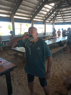 Drinking the customary ritual welcome drink of " KAVA" on arrival on SCHOONER ISLAND.