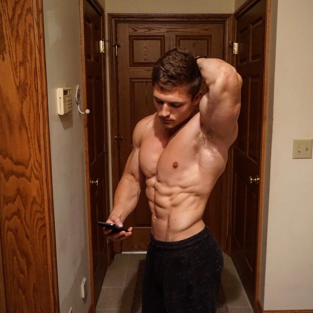 strong-shirtless-muscular-guy-abs-flexing-texting-phone