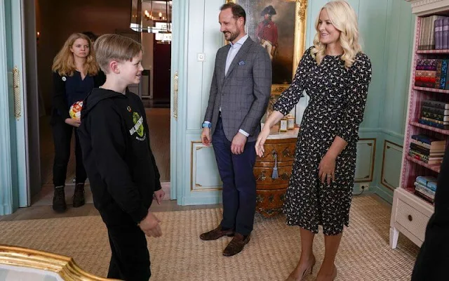 Crown Princess Mette-Marit wore an alicia birds print midi dress from Pia Tjelta. Crown Prince Haakon. Christian Louboutin simple pumps